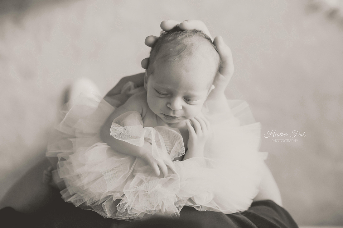 ballerina baby girl in daddy's arms