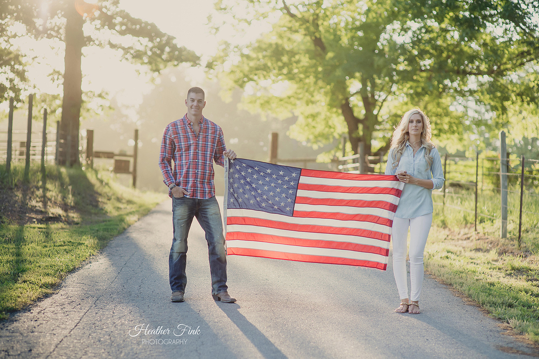 american flag held by engaged couple