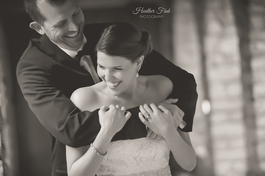 groom laughs with bride