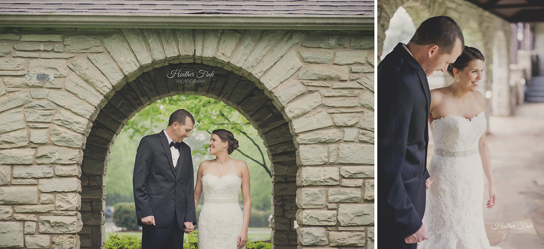 bride and groom portraits under stone arch