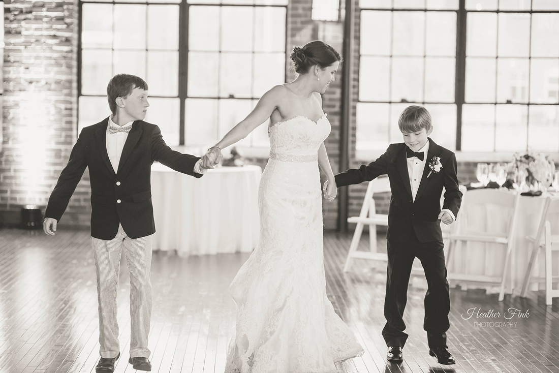 bride dances with young boys